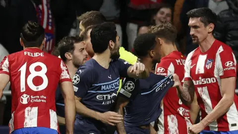 Man City and Atletico players clash