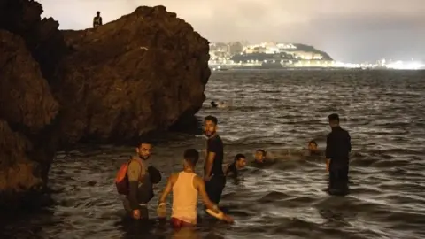 AFP Migrants in water at Fnideq, 18 May 21