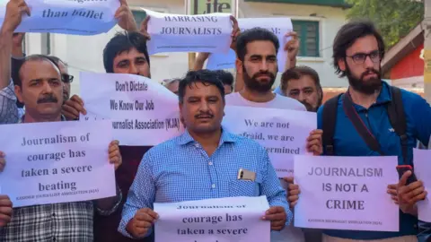 Getty Images Journalist fraternity of Kashmir hold protest on Monday in Srinagar against the arrest of their colleague Asif Sultan who works as an editor for the monthly magazine the Kashmir Narrator.