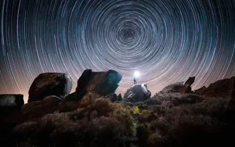 Ben Lockett / SWNS Star trail over Ramshaw Rocks in the Staffordshire Moorlands, Staffordshire