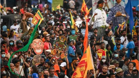 Getty Images Protesters take part in an anti-government demonstration near the president's office in Colombo on April 30, 2022, demanding President Gotabaya Rajapaksas resignation over the country's crippling economic crisis.