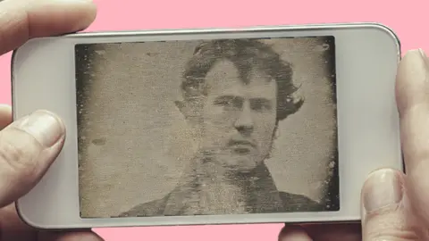 Getty Images A phone showing Robert Cornelius's selfie