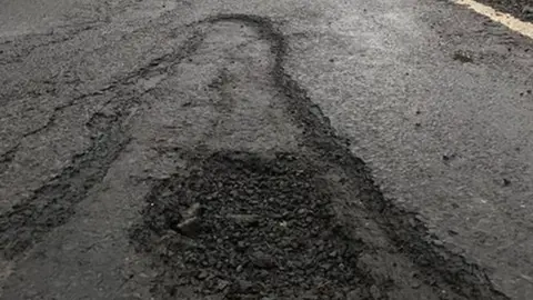 Michelle Duffy pothole picture on The Shore Road between Enniskillen and Belleek