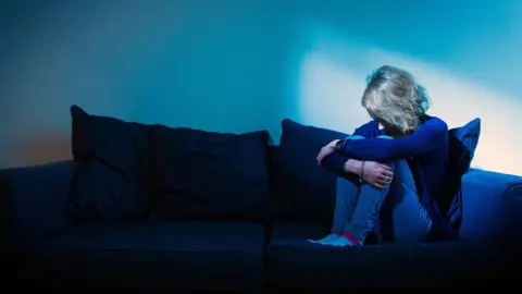 PA Media Woman looking lonely