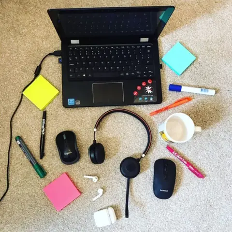 Gemma Lawrence Computer and headphones