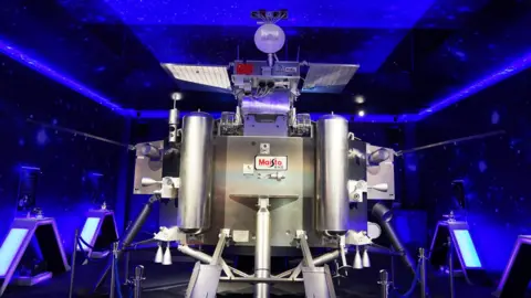 Getty Images A mock-up of the Chang'e-4 lander and rover, on display in Dongguan, China
