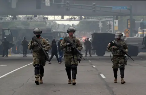 Reuters Three soldiers in Minneapolis