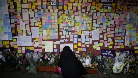 Reuters condolence messages on a wall in Itaewon