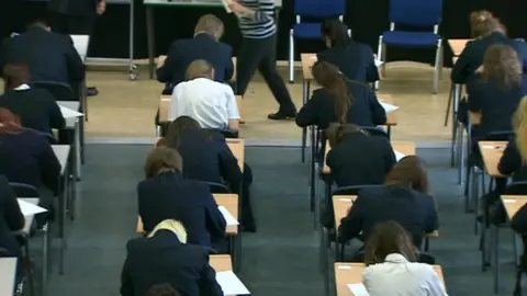 Pupils in a school exam room