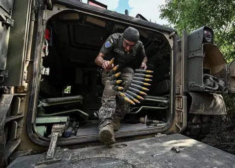 Reuters A Ukrainian serviceman prepares an M2 Bradley infantry fighting vehicle for combat