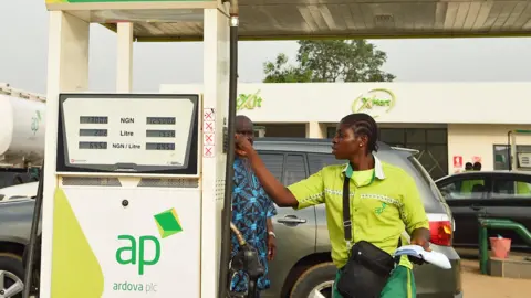 AFP An attendant sells diesel to a motorist at a filling station at Warewa, along Lagos-Ibadan expressway, Ogun State, south-west Nigeria - March 2022