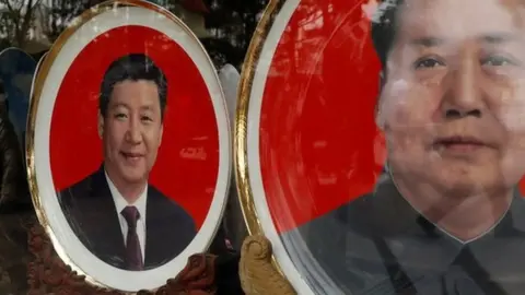 Reuters Souvenir plates with images of Chinese late Chairman Mao Zedong and Chinese President Xi Jinping.