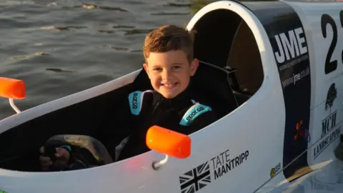 Jamie Niblock/BBC Tate Mantripp in a powerboat