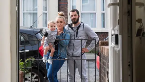 Jon Parker Lee Joanne Goffey and Marshall Kinder-Maiss with their child