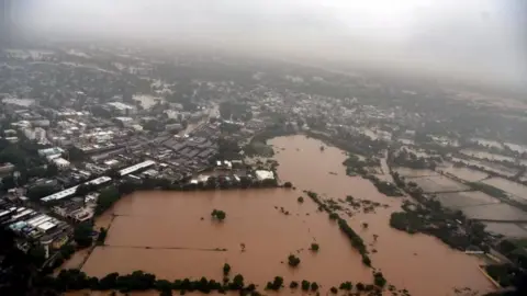 AFP A handout picture from the Gujarat Information Bureau taken and released on July 25, 2017 from an Indian Air Force helicopter shows villages of Banaskantha district, Gujarat state, surrounded by water due to floods.