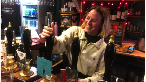 BBC Amy Bright behind the bar