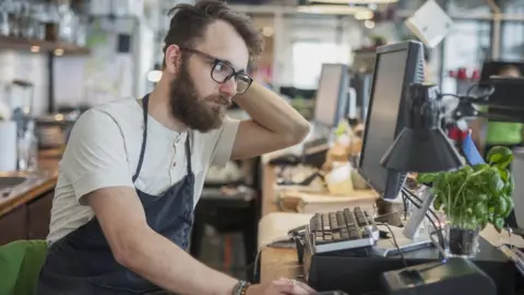 Getty Images Worried business owner