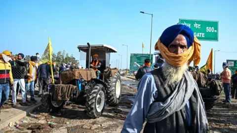 Getty Images Demonstrators during a protest by farmers near the Haryana-Punjab state border in Rajpura, Punjab, India, on 21 February