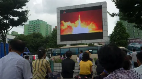 Getty Images People in the North Korean capital Pyongyang watch coverage of an ICBM missile test on July 29, 2017
