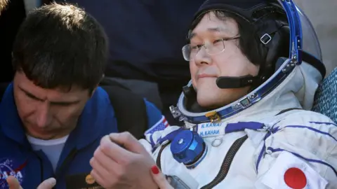 AFP Japan's Norishige Kanai is attended to by ground crew. 3 June 2018