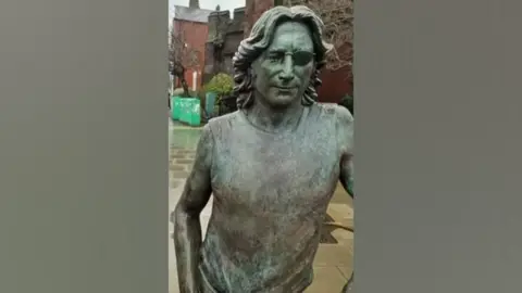 Laura Lian John Lennon Peace Statue showing damage