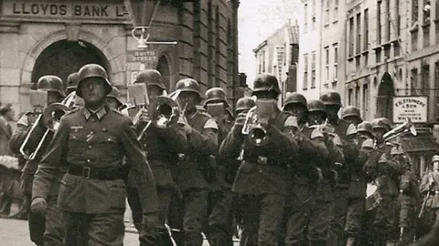 Island Archives A German band marches through Guernsey's St Peter Port High Street