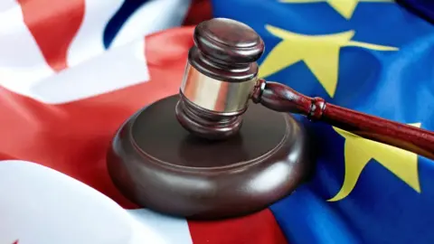 Getty Images Gavel on UK and EU flags