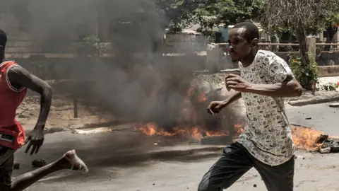 Getty Images Protesters running in Dakar, Senegal. Photo: 1 June 2023