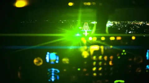 Getty Images Impression of effect of laser light in cockpit of plane