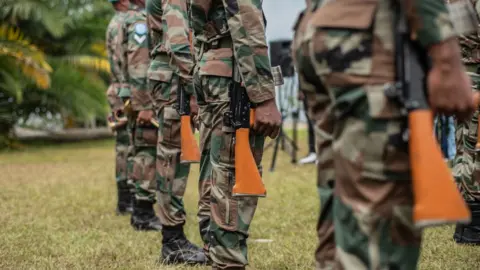 STR/EPA-EFE/REX/Shutterstock United Nations (UN) personnel during a ceremony to pay tribute to UN peacekeepers killed during a protest in Butembo in Goma, Democratic Republic of Congo (DRC), 01 August 2022. T
