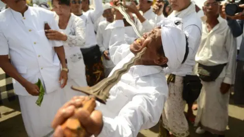 AFP/Getty The Melasti ritual involves elaborate purification rituals