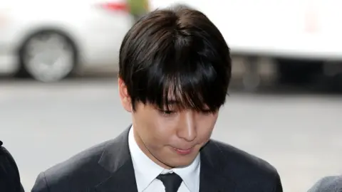 Getty Images Choi Jong-Hoon arriving at a Seoul police station in 2019