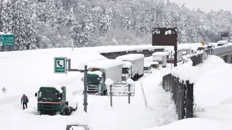 Reuters Vehicles are stranded on the snow-covered Kanetsu expressway in Minamiuonuma in Niigata Prefecture,