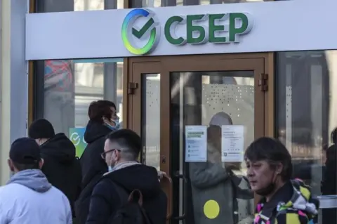 EPA People stand in line outside the Russian credit institution Sberbank in Moscow, Russia, 28 February 2022.