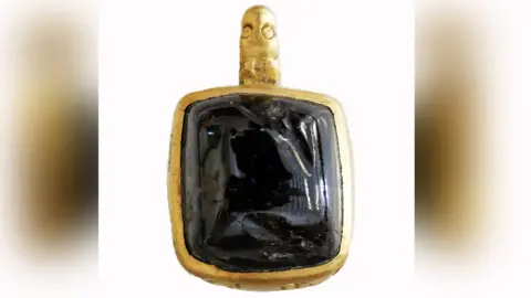 Surrey County Council Late 12th to early 13th Century gold and gem pendant