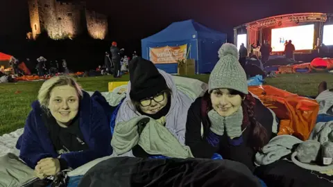 Llamau Young women on sleeping bags