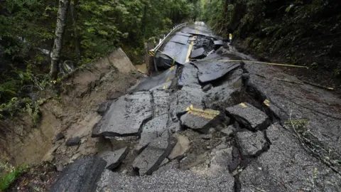 Getty Images A damaged road in the Santa Cruz mountains