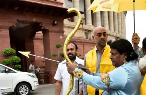 Getty Images Mr Sivaprasad attends parliament dressed as Hindu god Rama on 6 August 2018 in Delhi.