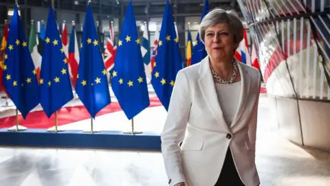 Getty Images Theresa May arriving at EU Summit