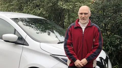 Andrew Capel Andrew Capel with an electric Renault Zoe