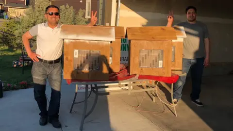 Syed Najam Hassan Syed Najam Hassan with bookshelves