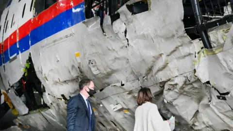 Pool/Getty Images Prosecutor Thijs Berger attends the judges' inspection of the reconstruction of the MH17 wreckage, as part of the murder trial ahead of the beginning of a critical stage, on May 26, 2021 in Reijen, Netherlands