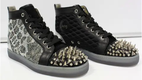 Wilsons Auctions  A pair of studded snake skin shoes