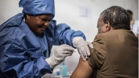 Getty Images A patient being given the Ebola vaccine