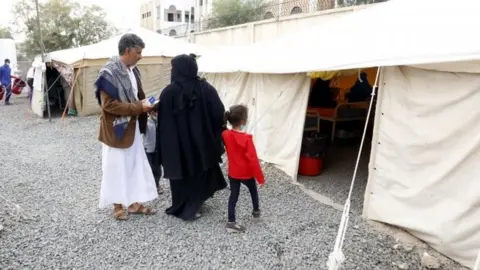 EPA Yemenis bring their children suspected of being infected with cholera to receive treatment at a hospital in Sanaa (15 June 2017)