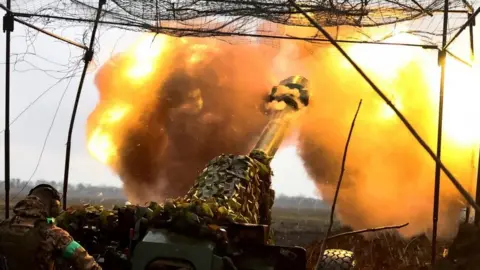 Reuters A Ukrainian soldier fires a cannon near Bakhmut, eastern Ukraine. File photo