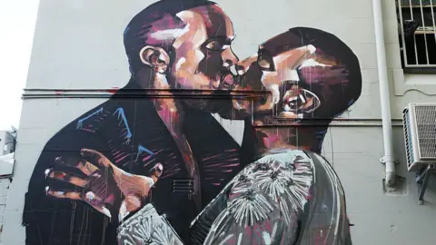 Getty Images The mural depicting Kanye West kissing himself