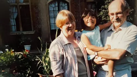 Family Photo Mimi Woods with her adoptive parents Lynne and Gareth Woods