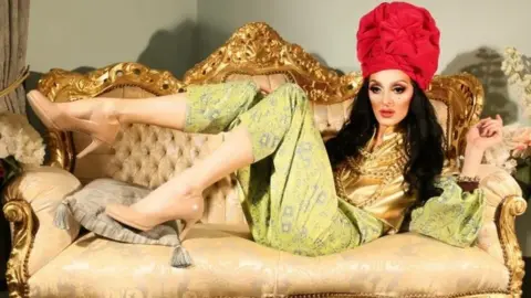 Eddie Adams Eddie OK Adams lying on a sofa