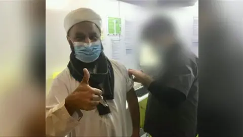 Facebook Cllr Aftab Razaq having the Covid vaccine